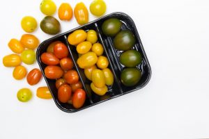 Colorful tomatoes in a tray